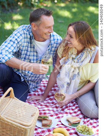Couple, picnic and alcohol for bonding in outdoor nature, love and romance in relationship on weekend. Wine glasses, conversation and people on date in countryside, adventure and forest for happy Couple, picnic and alcohol for bonding in outdoor nature, love and romance in relationship on weekend. Wine glasses, conversation and people on date in countryside, adventure and forest for happy 140408049