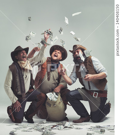 Money, thief and western with celebration of people in studio on gray background for robbery or heist. Texas, crime and smile with man gang throwing cash from bag in air for illegal theft or stealing 140408150