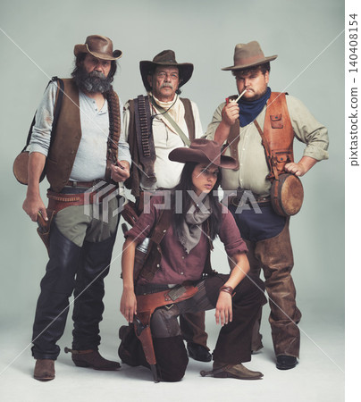 Vintage, western and portrait of cowboy in studio with fashion for halloween, costume and character. Man, woman and group of people with confidence for criminal, band and outlaw lifestyle together Vintage, western and portrait of cowboy in studio with fashion for halloween, costume and character. Man, woman and group of people with confidence for criminal, band and outlaw lifestyle together 140408154