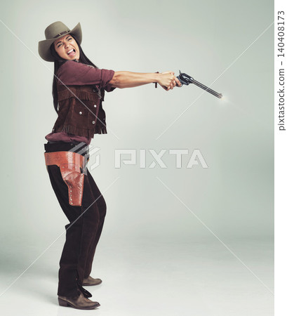 Cowgirl, woman and shooting gun, weapon or pistol in studio with costume isolated on white background mockup. Western, criminal and female person with revolver, scared or screaming in fear in Texas 140408173