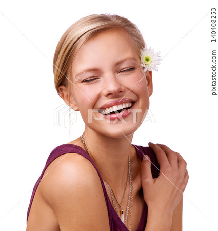 Flower, laugh and face of woman on a white background for skincare, wellness and spa aesthetic. Eyes closed, attractive and isolated person with floral, bloom or plant for natural cosmetics in studio 140408253