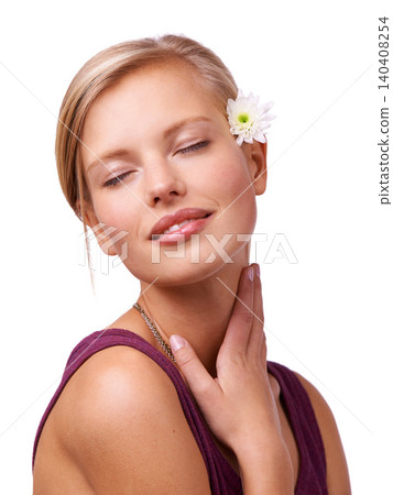 Flower, beauty and face of woman on a white background for skincare, wellness and spa aesthetic. Eye closed, attractive and isolated person with floral, bloom or plant for natural cosmetics in studio 140408254