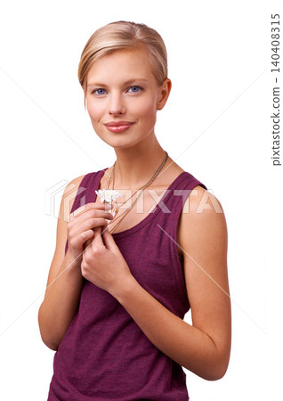 Studio, model and portrait with daisy by white background and happy for blossom of spring season. Woman, face and positive for flower plant for botanical wellness and symbol of new beginning or love 140408315