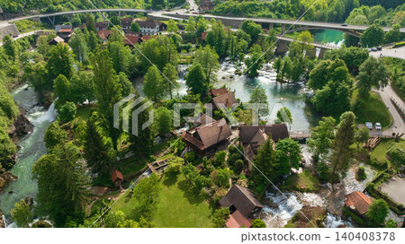 Drone captures beautiful canyon village of Rastoke near Slunj. Rapid rivers, waterfalls, and traditional wooden watermills integrate perfectly with lush green nature in famous Croatian landmark. Drone captures beautiful canyon village of Rastoke near Slunj. Rapid rivers, waterfalls, and traditional wooden watermills integrate perfectly with lush green nature in famous Croatian landmark. 140408378