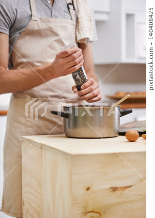 Chef, cooking and pot or pepper in kitchen or seasoning flavor as recipe nutrition at home or ingredients, meal or dinner. Person, apron and lunch prepare in apartment or health food, vitamin or diet Chef, cooking and pot or pepper in kitchen or seasoning flavor as recipe nutrition at home or ingredients, meal or dinner. Person, apron and lunch prepare in apartment or health food, vitamin or diet 140408425