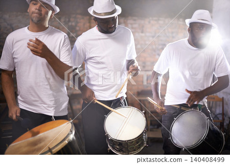 Man, drums and group band playing with instrument at festival, carnival or night party with lens flare. Male person, talented drummer or young musicians at concert for music performance and audition Man, drums and group band playing with instrument at festival, carnival or night party with lens flare. Male person, talented drummer or young musicians at concert for music performance and audition 140408499