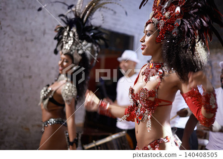 Women, dancer and samba for carnival and music festival or night performance with costume and band. Group, dancing and drums for event, celebration and culture or history in Rio de Janeiro, Brazil 140408505