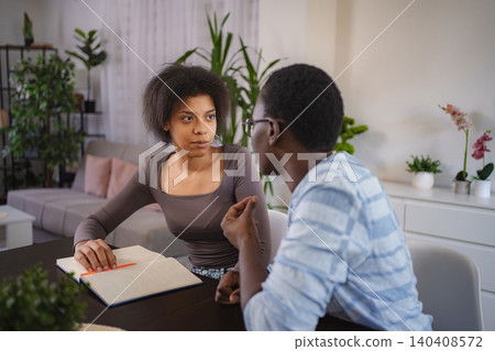 Young Students Studying Together at Home 140408572