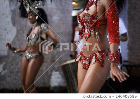 Women, dancer and samba for carnival and music festival or street performance with costume closeup. Body of person dancing with drums for event, tourism and celebration or culture in Rio de Janeiro Women, dancer and samba for carnival and music festival or street performance with costume closeup. Body of person dancing with drums for event, tourism and celebration or culture in Rio de Janeiro 140408589