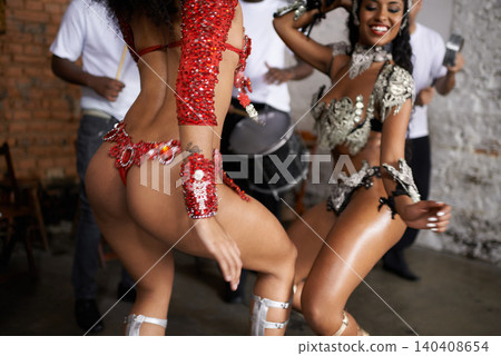 Woman, samba dancer and friends with costume for traditional performance at carnival or festival. Person or exotic performer with band for culture or dancing at party or concert in Rio de Janeiro Woman, samba dancer and friends with costume for traditional performance at carnival or festival. Person or exotic performer with band for culture or dancing at party or concert in Rio de Janeiro 140408654