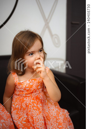 Little girl picking nose showing childhood habit Little girl picking nose showing childhood habit 140408730