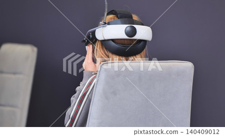Person exploring virtual reality gaming and metaverse simulation technology Person exploring virtual reality gaming and metaverse simulation technology 140409012