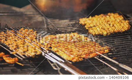 Delicious grilled meat cooking on barbecue in Vietnam Delicious grilled meat cooking on barbecue in Vietnam 140409106