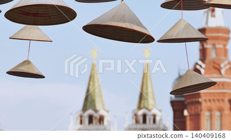 Vietnamese conical hats hanging with Moscow Kremlin in background 140409168