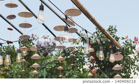 Vietnamese traditional conical hats hanging with light bulbs during Vietnam Days in Moscow 140409218