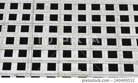 Moscow apartment building under construction, reflecting urban development and abstract patterns Moscow apartment building under construction, reflecting urban development and abstract patterns 140409552