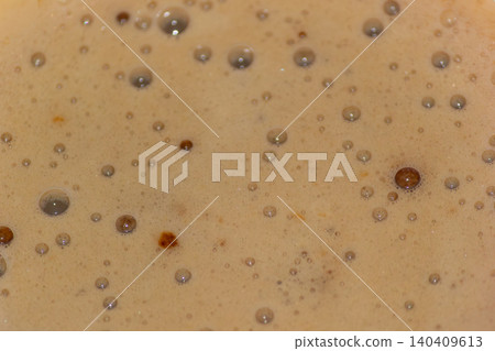 Macro texture of fresh coffee foam with small air bubbles 140409613