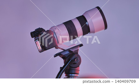 Mirrorless camera with telephoto lens on tripod capturing professional images Mirrorless camera with telephoto lens on tripod capturing professional images 140409709