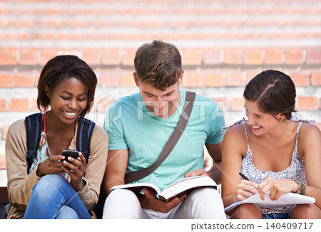Studying, friends and students with books at university for learning, knowledge and reading. Education, diversity and happy man and women with textbook for group project, exam preparation and college Studying, friends and students with books at university for learning, knowledge and reading. Education, diversity and happy man and women with textbook for group project, exam preparation and college 140409717