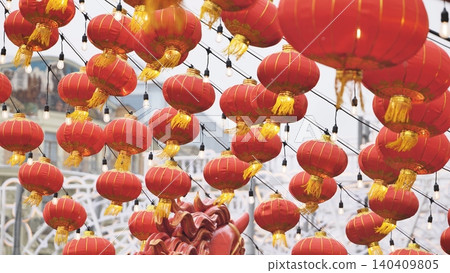 Chinese New Year celebration featuring traditional red lanterns and decorative lights Chinese New Year celebration featuring traditional red lanterns and decorative lights 140409805