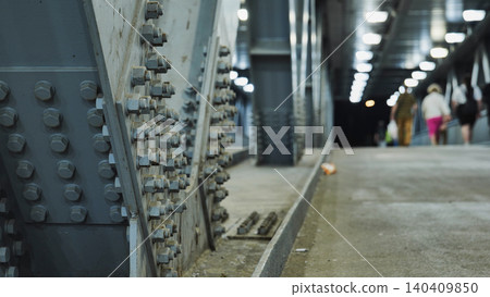 Pedestrian crossing on a bridge with people. 140409850