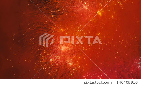 Fireworks exploding over Moscow, creating a vibrant red and orange light display 140409916