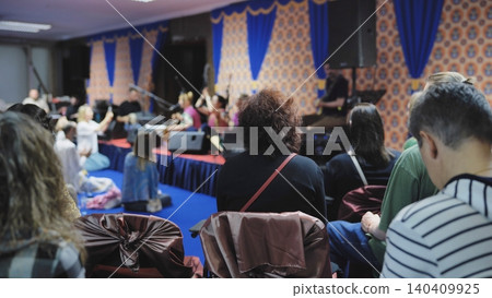 Audience enjoying traditional Indian music performance during Ganesh Chaturthi festival 140409925