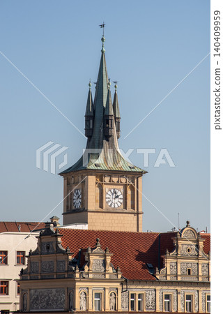Historic clock tower above ornate old city rooftops 140409959