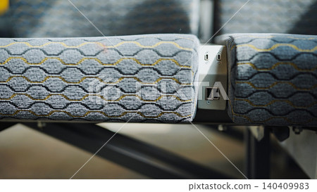 Usb charging ports between passenger seats in modern comfortable bus Usb charging ports between passenger seats in modern comfortable bus 140409983