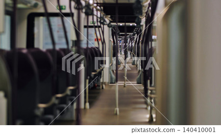 Empty modern train car showing seats and aisle Empty modern train car showing seats and aisle 140410001