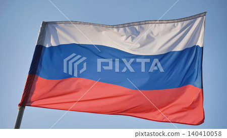 Russian national flag waving on a clear sky, symbolizing country patriotism Russian national flag waving on a clear sky, symbolizing country patriotism 140410058