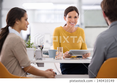 Happy, business woman and interview with tablet for meeting, recruiting or hiring at office desk. Female person, recruiter or employee in team discussion with technology for opportunity at workplace 140410149