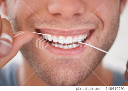 Dental, floss and closeup of man with teeth whitening, fresh breathe and cavity prevention for health and hygiene. Oral care, string or thread for orthodontics with veneers and mouth cleaning Dental, floss and closeup of man with teeth whitening, fresh breathe and cavity prevention for health and hygiene. Oral care, string or thread for orthodontics with veneers and mouth cleaning 140410291