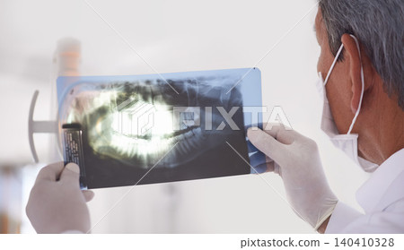 Dentist, man and xray closeup of teeth for dental surgery, healthcare and oral health at clinic. Medical professional with analysis of scan, radiology and orthodontics for mouth care with treatment Dentist, man and xray closeup of teeth for dental surgery, healthcare and oral health at clinic. Medical professional with analysis of scan, radiology and orthodontics for mouth care with treatment 140410328