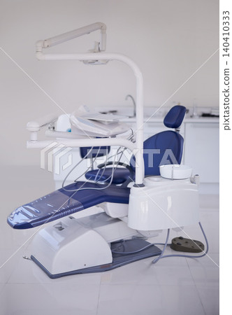 Dental, chair and healthcare at dentist office, medical equipment or furniture for oral health and wellness. Orthodontics, dentistry and treatment workspace for mouth care at orthodontist clinic Dental, chair and healthcare at dentist office, medical equipment or furniture for oral health and wellness. Orthodontics, dentistry and treatment workspace for mouth care at orthodontist clinic 140410333