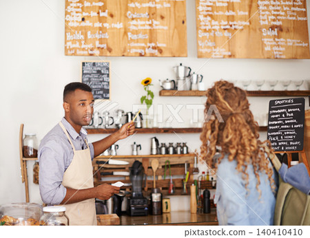 Woman, coffee shop and waiter with pointing at menu for customer, purchase and decision in cafe. Barista, small business and lady in restaurant with help, shopping and choice for lunch order Woman, coffee shop and waiter with pointing at menu for customer, purchase and decision in cafe. Barista, small business and lady in restaurant with help, shopping and choice for lunch order 140410410