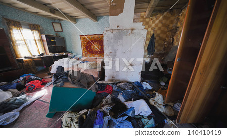Abandoned messy room showing clutter, poverty, and derelict living conditions 140410419