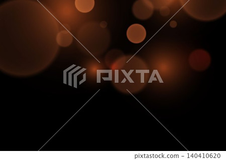 Defocused orange light circles glittering against a dark black background Defocused orange light circles glittering against a dark black background 140410620