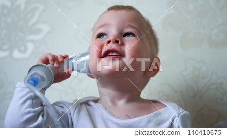 Baby receiving nebulizer treatment for breathing issues, looking up with curiosity Baby receiving nebulizer treatment for breathing issues, looking up with curiosity 140410675