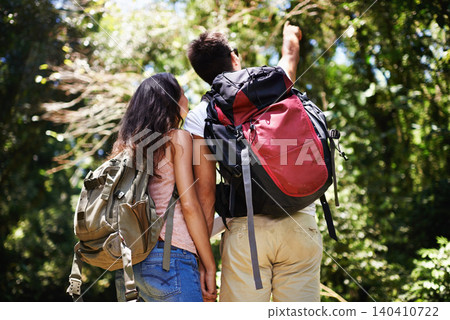 Hiking, pointing and back of couple in nature for adventure, love and explore outdoors. Forest, travel and man and woman with view on holiday, vacation and trekking for wellness, fitness or health Hiking, pointing and back of couple in nature for adventure, love and explore outdoors. Forest, travel and man and woman with view on holiday, vacation and trekking for wellness, fitness or health 140410722