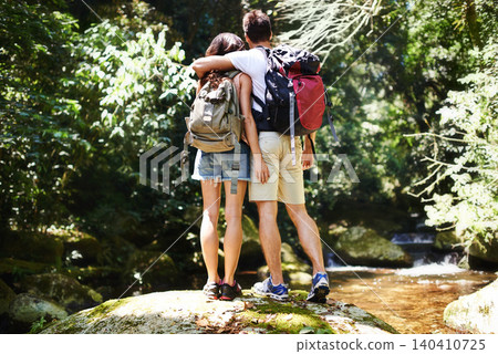 Hug, nature and back of couple in forest for hiking, trekking and adventure for wellness, relax and explore. Dating, love and man and woman on holiday, vacation and travel on weekend for exercise Hug, nature and back of couple in forest for hiking, trekking and adventure for wellness, relax and explore. Dating, love and man and woman on holiday, vacation and travel on weekend for exercise 140410725