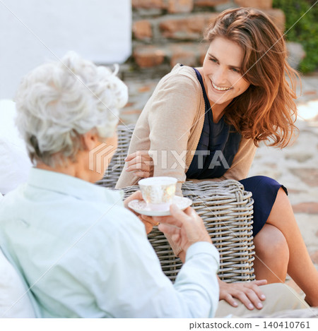Mom, daughter and coffee with conversation in happiness to bond at home, outdoor and support with care. Family, women and together with smile on break for visit, joy and love to create memories Mom, daughter and coffee with conversation in happiness to bond at home, outdoor and support with care. Family, women and together with smile on break for visit, joy and love to create memories 140410761