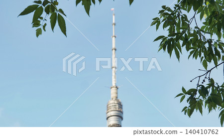Ostankino Tower, Moscow, providing broadcasting and telecommunications through green foliage Ostankino Tower, Moscow, providing broadcasting and telecommunications through green foliage 140410762