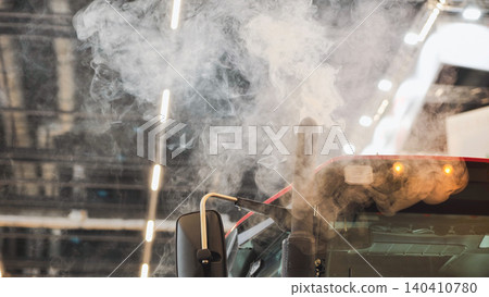 Truck emitting exhaust smoke causing air pollution and environmental impact Truck emitting exhaust smoke causing air pollution and environmental impact 140410780