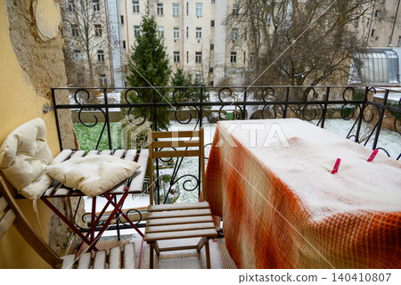 Snow on a small apartment balcony in winter Snow on a small apartment balcony in winter 140410807