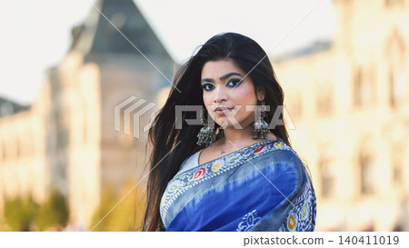 Bangladeshi woman wearing saree and jhumka earrings in Moscow, traveling ethnic fashion Bangladeshi woman wearing saree and jhumka earrings in Moscow, traveling ethnic fashion 140411019