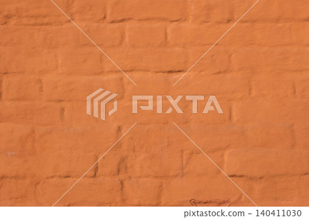 Orange painted brick wall texture with rough surface for backgrounds 140411030