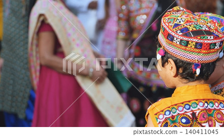 Indian festival celebration showing children wearing vibrant traditional embroidered clothing 140411045