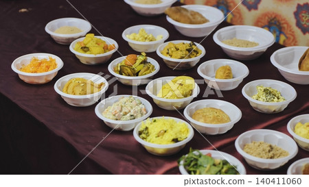 Indian food dishes serving as Prasad offering during cultural festival celebration Indian food dishes serving as Prasad offering during cultural festival celebration 140411060