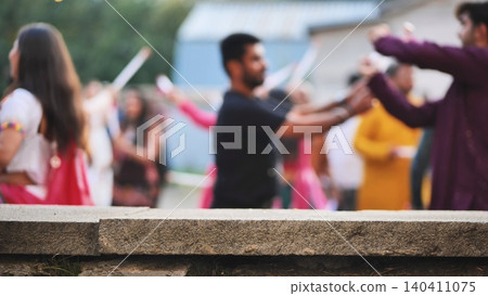 People enjoying Ganesh Chaturthi, performing Garba folk dance, having fun outdoors People enjoying Ganesh Chaturthi, performing Garba folk dance, having fun outdoors 140411075